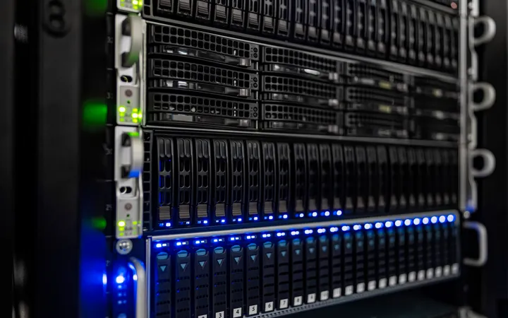 Rows of server hardware with blue and green indicator lights at NOIRLab headquarters.